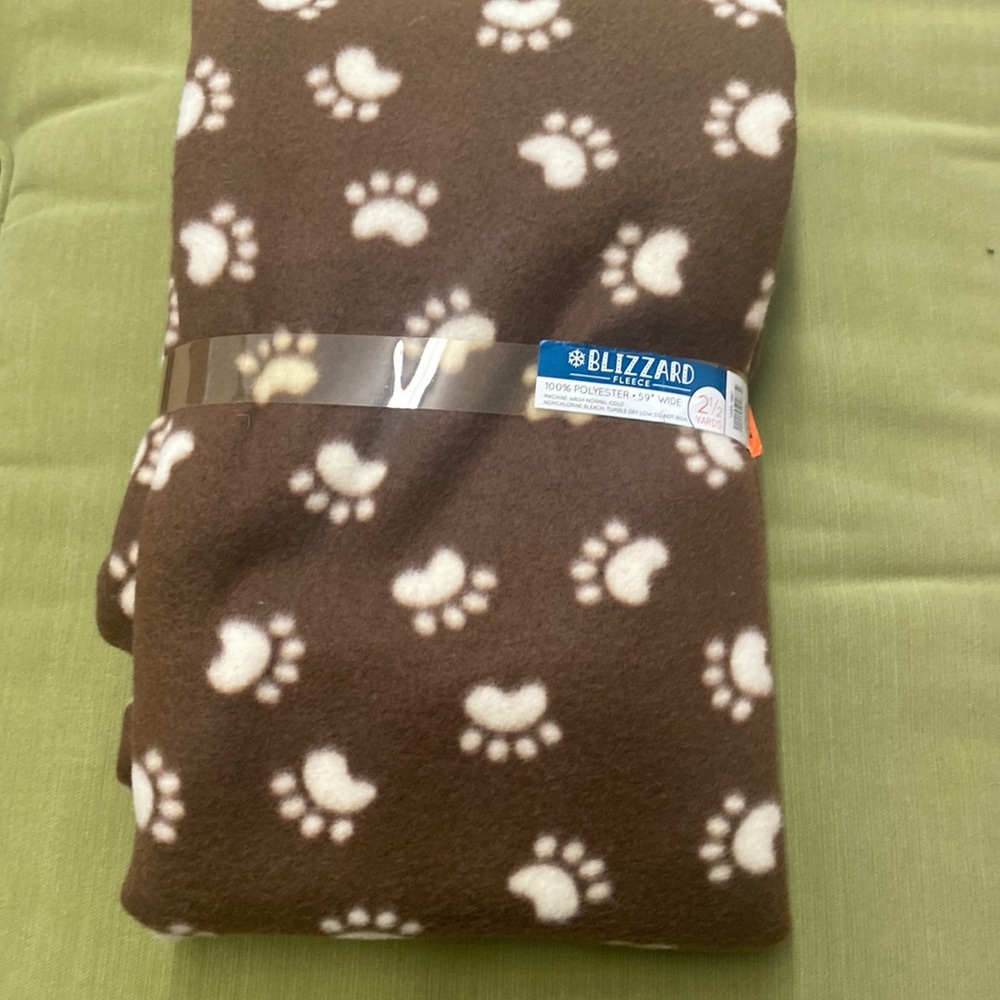 Brown fleece material with cream paw prints- 2 1/2 yards